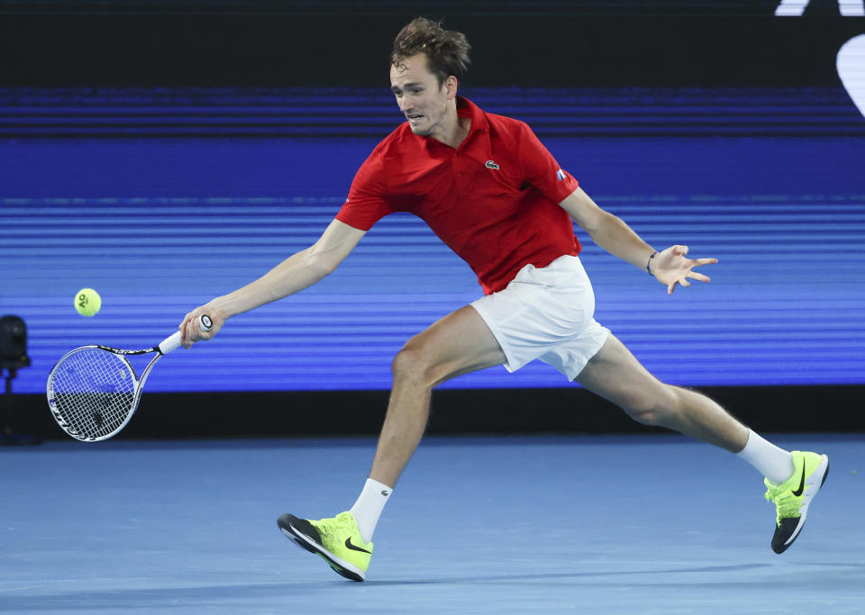 Russia' Daniil Medvedev makes a forehand return to Germany's Alexander Zverev in their ATP Cup semifinal match in Melbourne, Australia, Saturday, Feb. 6, 2021.(AP Photo/Hamish Blair)