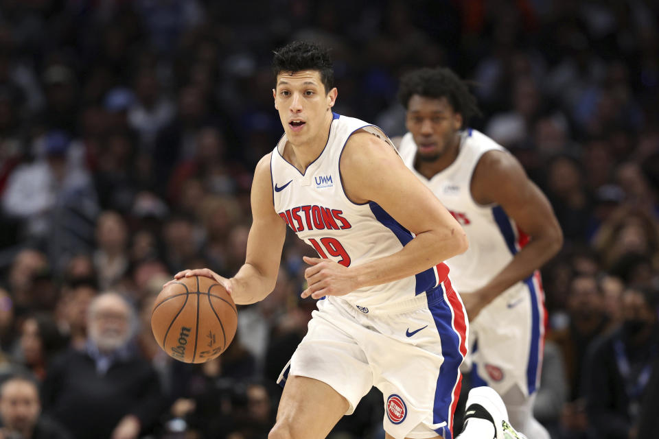 Detroit Pistons forward Simone Fontecchio, front, brings the ball down the court during the second half of an NBA basketball game against the Los Angeles Clippers, Saturday, Feb. 10, 2024, in Los Angeles. (AP Photo/Raul Romero Jr.)