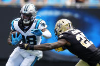 Carolina Panthers wide receiver Terrace Marshall Jr. is tackled by New Orleans Saints strong safety Malcolm Jenkins during the first half of an NFL football game Sunday, Sept. 19, 2021, in Charlotte, N.C. (AP Photo/Jacob Kupferman)