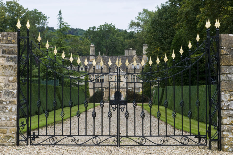The gated entryway to a mansion