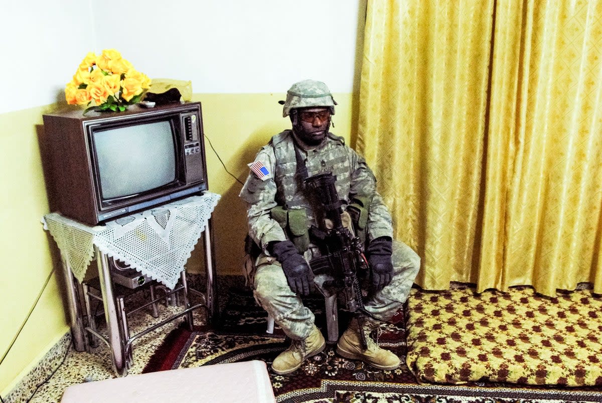 An American soldier rests during a night raid in Rawa, Iraq in 2006  (Peter van Agtmael/Magnum Photos)