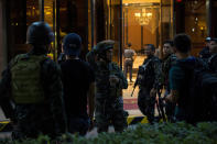 <p>Philippines' police officers gesture as they stand guard by the Resorts World Hotel in Manila on June 2, 2017 following an assault. (Photo: Noel Celis/AFP/Getty Images) </p>