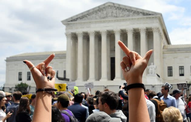 Abortion rights activists react to the seismic court decision overturning Roe v. Wade outside the Supreme Court in Washington, D.C., on June 24. (Photo: OLIVIER DOULIERY via Getty Images)