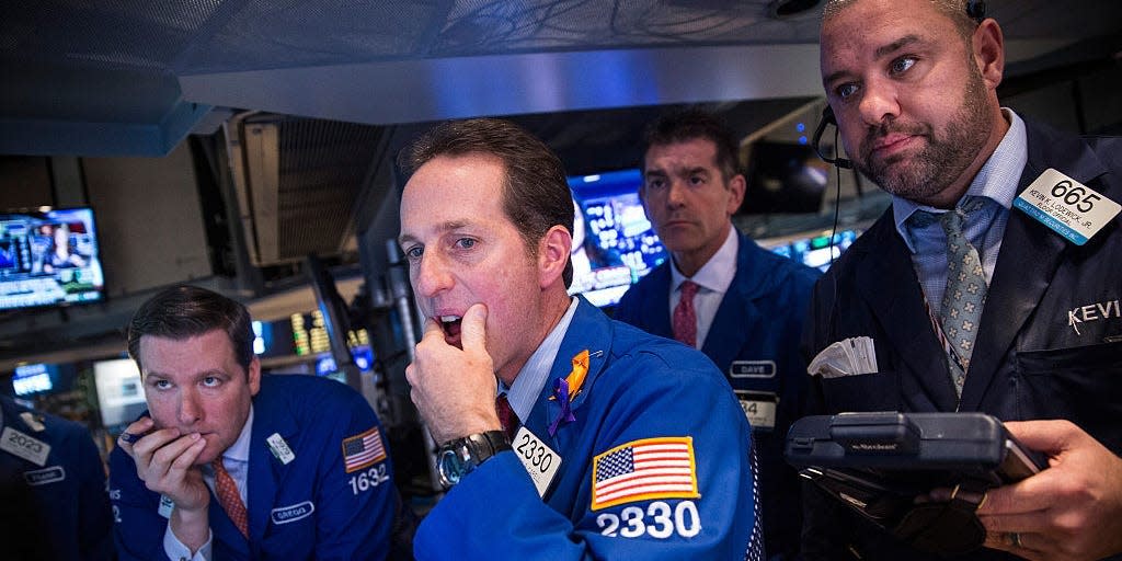 Traders work on the floor of the New York Stock Exchange