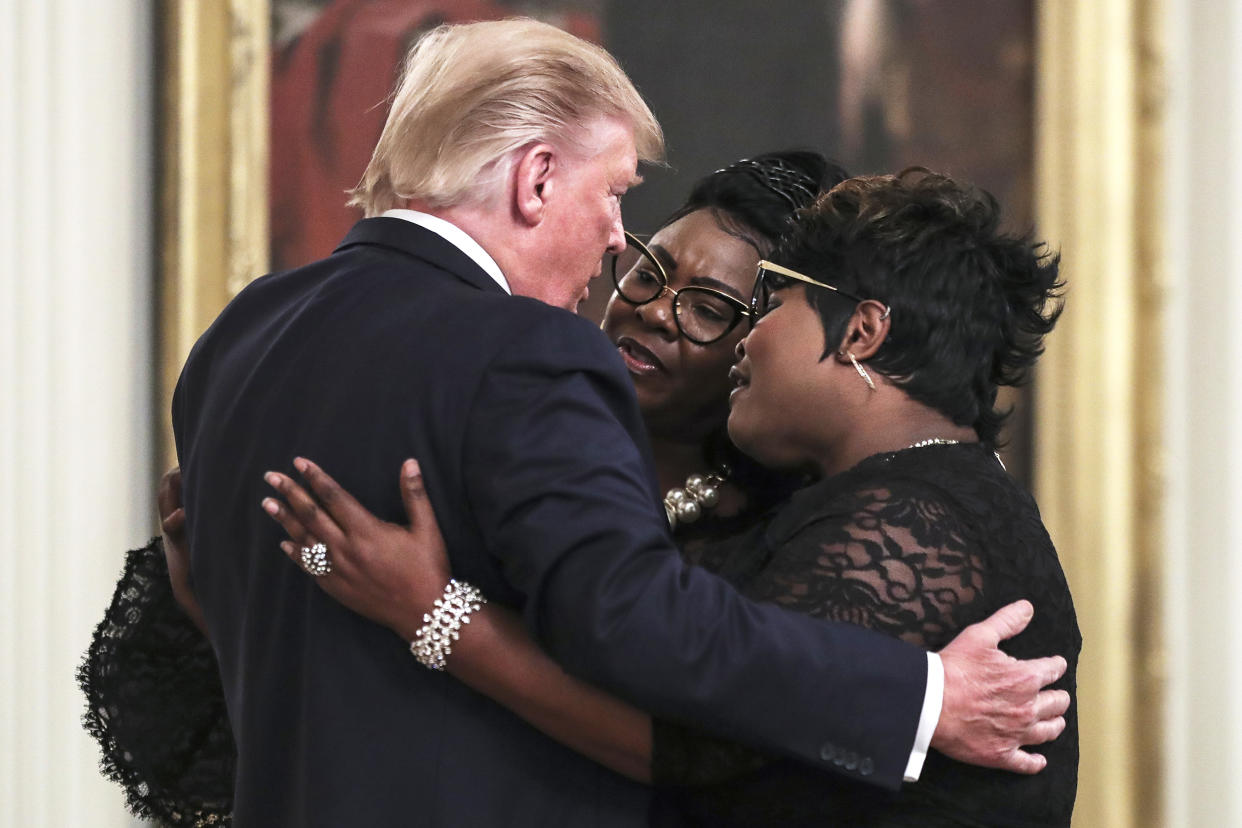 President Donald Trump hugs conservative social media figure Rochelle Richardson, known as Silk of 