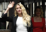 Amber Heard arrives at High Court, in London, Monday, July 27, 2020. Hollywood actor Johnny Depp is suing News Group Newspapers over a story about his former wife Amber Heard, published in The Sun in 2018 which branded him a 'wife beater', a claim he denies.(AP Photo/Alberto Pezzali)