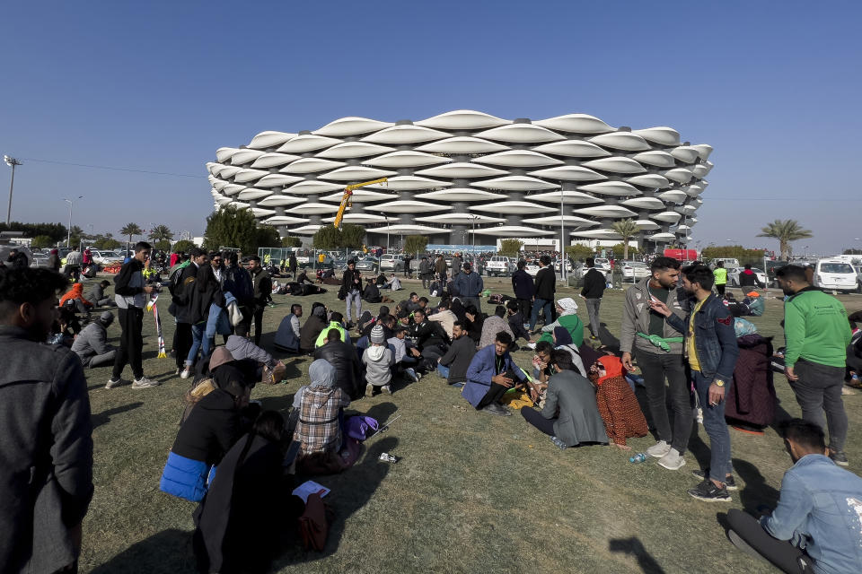 Football fans gather outside the Basra International Stadium in Basra, Iraq, Thursday, Jan 19, 2023. A stampede outside the stadium has killed and injured a number of people, a health official said. (AP Photo/Anmar Khalil)