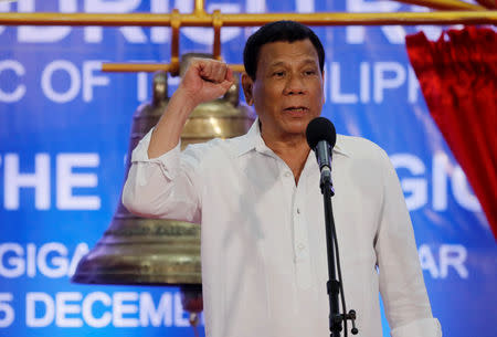 FILE PHOTO: President Rodrigo Duterte speaks during a ceremony marking the return of the three Balangiga bells taken by the U.S. military as war booty 117 years ago, at Balangiga, Eastern Samar in central Philippines December 15, 2018. REUTERS/Erik De Castro