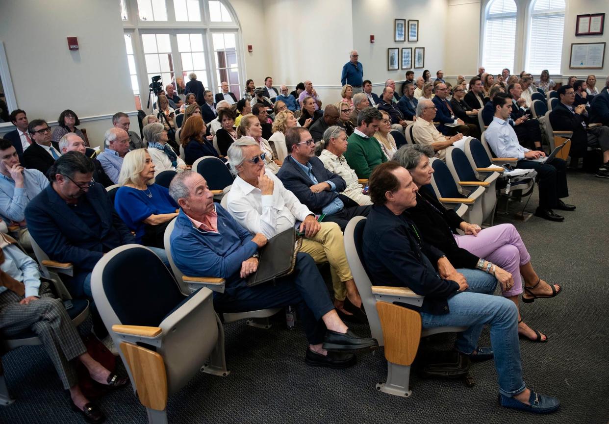 People attending the Development Review meeting Jan. 10 in Town Council chambers listen to Daniel Lobitz of Robert A.M. Stern Architects talk about possible architectural plans for the Paramount Theatre building.