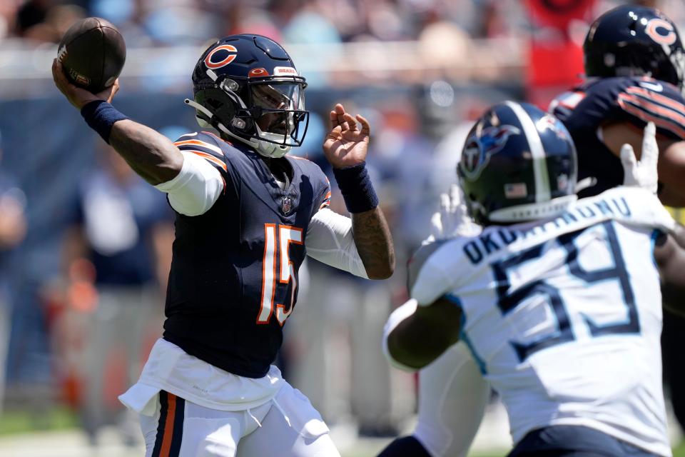 Chicago Bears quarterback PJ Walker (15) throws against the Tennessee Titans during the first half of an NFL preseason football game, Saturday, Aug. 12, 2023, in Chicago. (AP Photo/Charles Rex Arbogast)