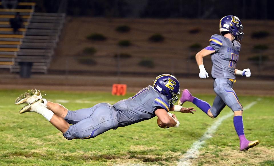 Escalon's Ryker Peters (1) tries to gain yards  during a Sac-Joaquin Section playoff game against Pacheco High, played at Escalon, Friday, Nov. 4, 2022.