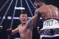 Ukraine's Arnold Khegai, left, punches Stephen Fulton during the 11th round of a WBO Intercontinental Jr. featherweight championship boxing match Saturday, Jan. 25, 2020, in New York. Fulton won the fight. (AP Photo/Frank Franklin II)