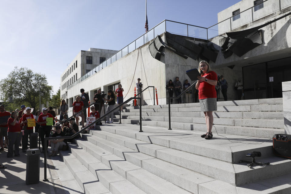 Hilary Uhlig, Oregon chapter leader for Moms Demand Action for Gun Sense America, speaks during a rally calling for an end to the Senate Republican walkout at the Oregon State Capitol in Salem, Ore., Thursday, May 11, 2023. (AP Photo/Amanda Loman)