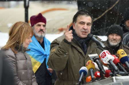 FILE PHOTO: Former Georgian President Mikheil Saakashvili, accompanied by his wife Sandra Roelofs, addresses his supporters in front of the Parliament building in Kiev, Ukraine December 6, 2017. REUTERS/Oleh Tereshchenko