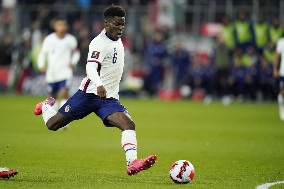 FILE - United States' Yunus Musah shoots against Mexico during the first half of a FIFA World Cup qualifying soccer match between Mexico and the United States, Friday, Nov. 12, 2021, in Cincinnati. Tim Weah, Antonee Robinson, Yunus Musah and Zack Steffen will be out with injuries when the United States plays Japan on Friday, Sept. 23, 2022, at Düsseldorf, Germany, in the Americans' next-to-last World Cup warmup. (AP Photo/Julio Cortez, File)