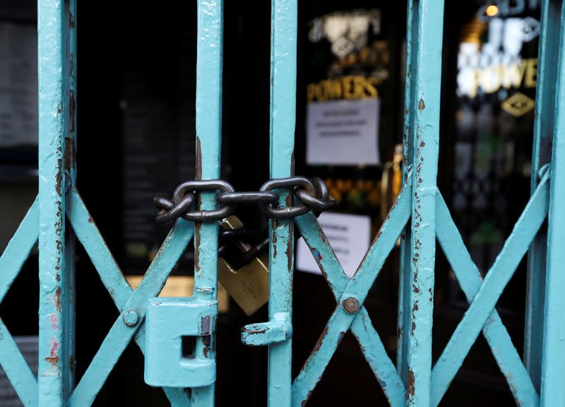 Pub doors are locked in the Temple Bar area of Dublin, as bars across Ireland are to close voluntarily to curb the spread of coronavirus in Dublin