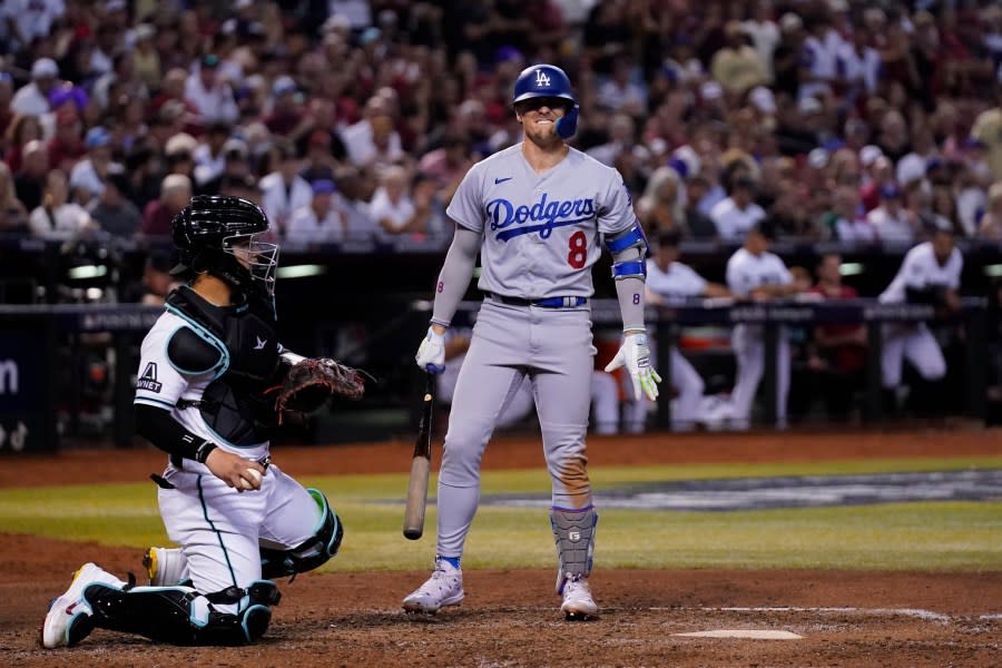 Los Angeles Dodgers’ Kiké Hernández reacts to a called strike as Arizona Diamondbacks catcher Gabriel Moreno looks on during the seventh inning in Game 3 of a baseball NL Division Series, Wednesday, Oct. 11, 2023, in Phoenix. (AP Photo/Ross D. Franklin)