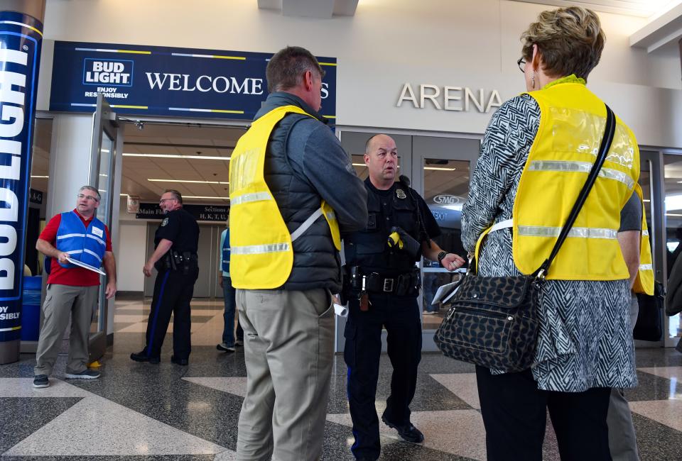 Sioux Falls police officer Eric Kimball speaks to observers from other city organizations and school districts about the parent-child reunification process created by the Sioux Falls School District as part of an emergency evacuation exercise at the Sioux Falls Arena and Convention Center in South Dakota.