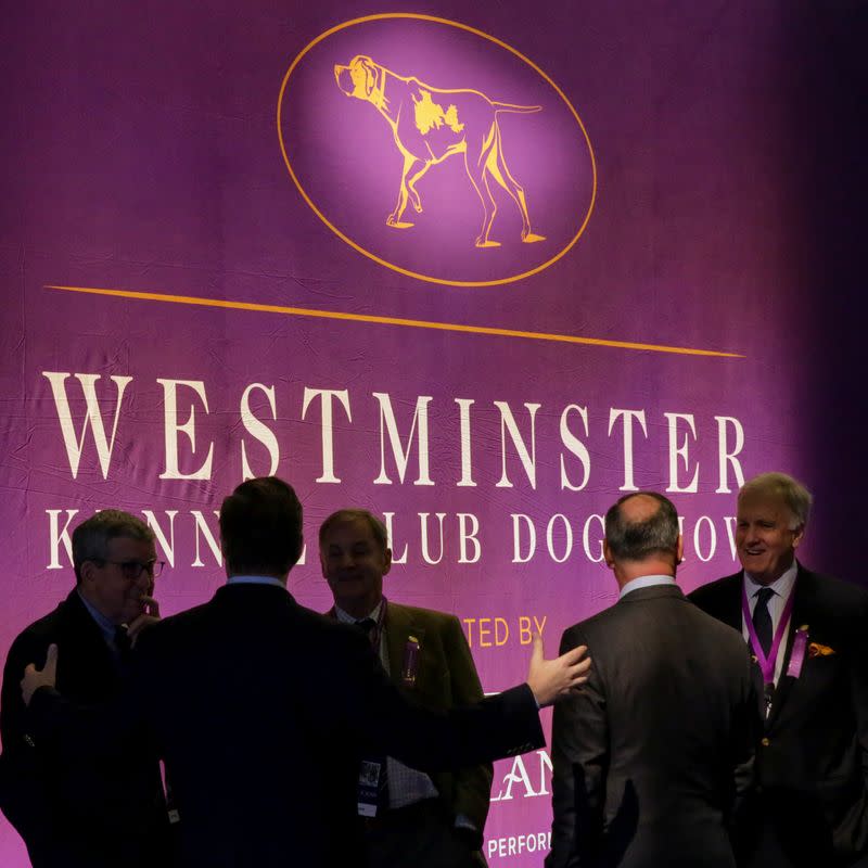 Men chat during the Westminster Kennel Club Dog Show in New York