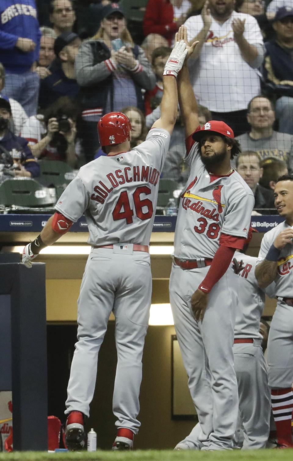 St. Louis Cardinals' Paul Goldschmidt is congratulated by Jose Martinez after hitting a two-run home run during the first inning of a baseball game against the Milwaukee Brewers Friday, March 29, 2019, in Milwaukee. (AP Photo/Morry Gash)