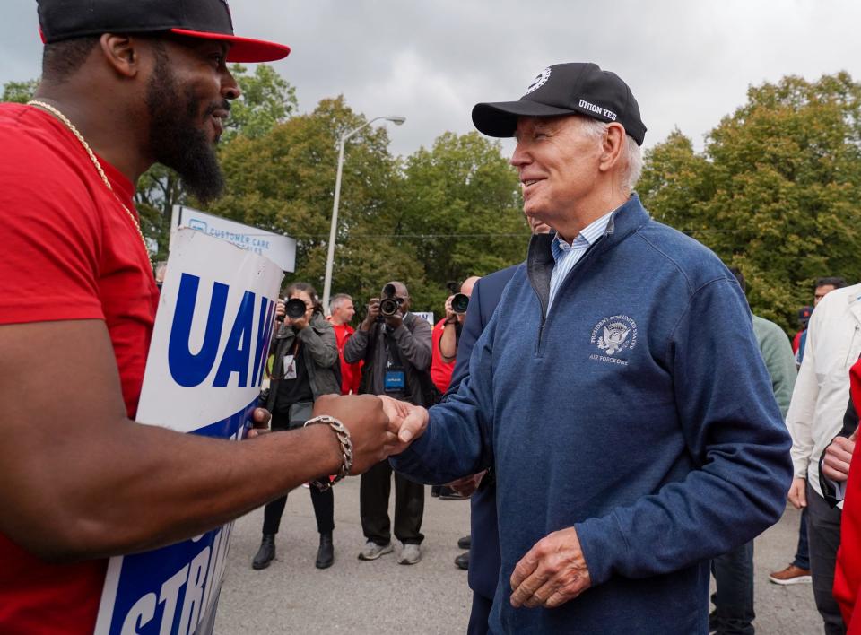 President Joe Biden speaks with workers picketing at General Motors Willow Run Redistribution in Belleville on Tuesday, September 26, 2023, during a stop in Michigan.