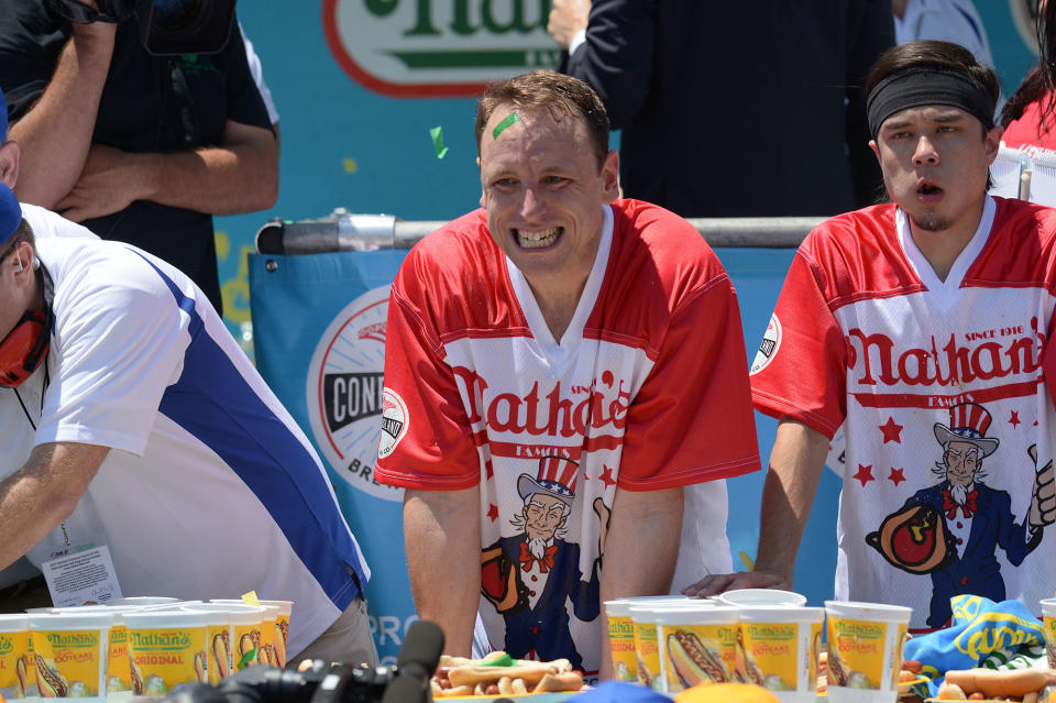 <p>Current world record holder Joey Chestnut (L) after beating top contender Matt Stonie for the win at Nathan’s Famous Fourth of July International Hot Dog Eating Contest at Coney Island in Brooklyn, New York City, U.S., July 4, 2017. (Erik Pendzich/REX/Shutterstock) </p>