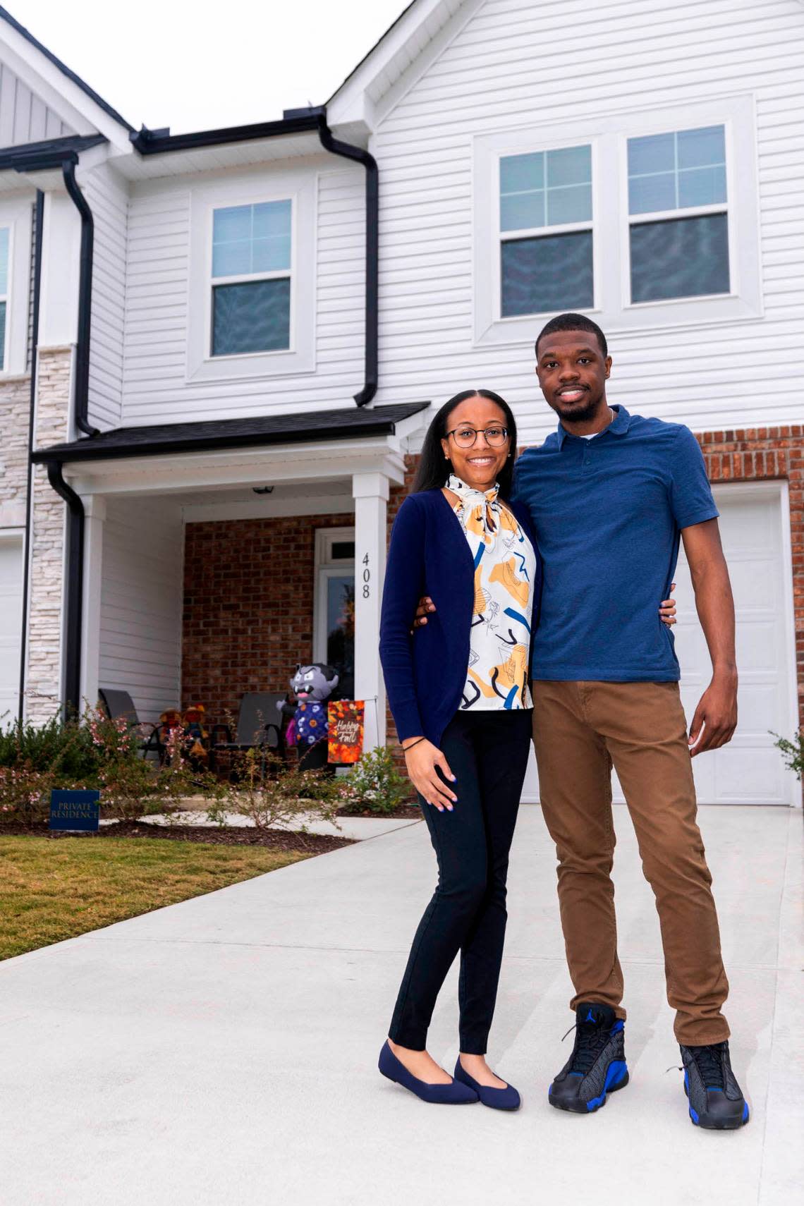 Deondre and Ariel Cason at their new two-story townhouse in the Barrington subdivision, outside Zebulon. Travis Long/tlong@newsobserver.com