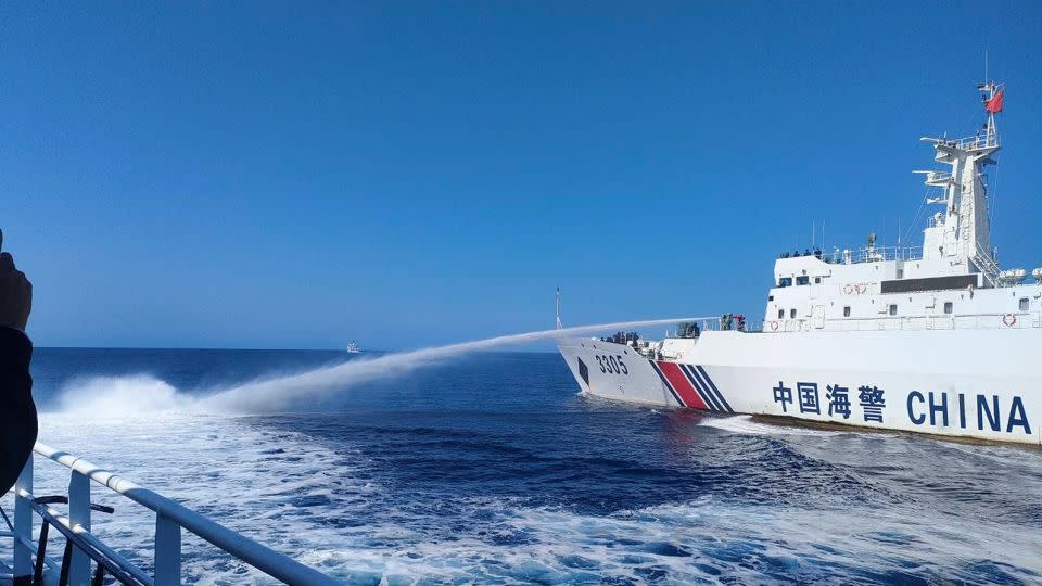 In this photo provided by the Philippine Coast Guard, a Chinese Coast Guard ship, right, uses its water cannons on a Philippine Bureau of Fisheries and Aquatic Resources (BFAR) vessel as it approaches Scarborough Shoal in the disputed South China Sea on Saturday December 9, 2023. - Philippine Coast Guard/AP