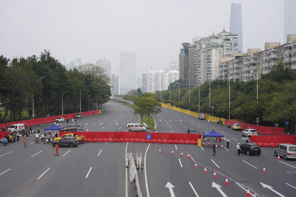 Barriers form a security checkpoint in the Haizhu district in Guangzhou in southern China's Guangdong province Friday, Nov. 11, 2022. As the country reported 10,729 new COVID cases on Friday, more than 5 million people were under lockdown in the southern manufacturing hub Guangzhou and the western megacity Chongqing. (AP Photo)