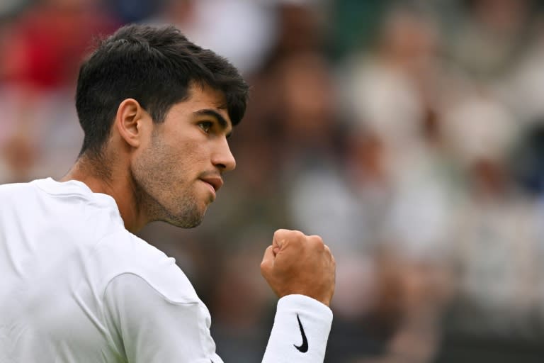 Defending Wimbledon champion <a class="link " href="https://sports.yahoo.com/soccer/players/1997017/" data-i13n="sec:content-canvas;subsec:anchor_text;elm:context_link" data-ylk="slk:Carlos Alcaraz;sec:content-canvas;subsec:anchor_text;elm:context_link;itc:0">Carlos Alcaraz</a> beat <a class="link " href="https://sports.yahoo.com/soccer/teams/australia/" data-i13n="sec:content-canvas;subsec:anchor_text;elm:context_link" data-ylk="slk:Australia;sec:content-canvas;subsec:anchor_text;elm:context_link;itc:0">Australia</a>'s Aleksandar Vukic to reach the third round (ANDREJ ISAKOVIC)