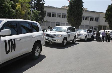 U.N. vehicles, carrying United Nations chemical weapons experts, arrive at Yousef al-Azma military hospital in Damascus August 30, 2013. REUTERS/Khaled al-Hariri