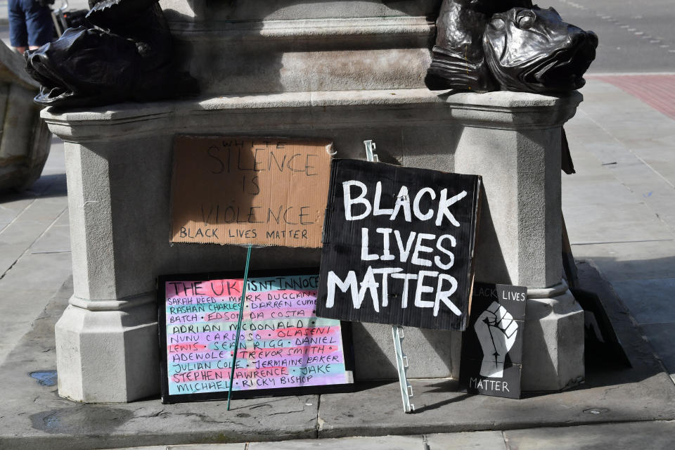 Signs by the empty plinth where the statue of Edward Colston in Bristol once stood after it was taken down during a Black Lives Matter protest on Sunday. The protests were sparked by the death of George Floyd, who was killed on May 25 while in police custody in the US city of Minneapolis.