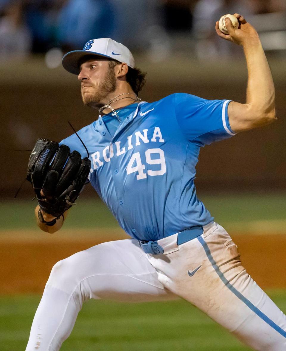 North Carolina pitcher Dalton Pence (49) delivers the final pitch of the game to LSU’s Josh Pearson, who flied out, securing the Tar Heels’ 4-3 victory in the tenth inning and winning the NCAA Regional on Monday, June 3, 2024 at Boshamer Stadium in Chapel Hill, N.C.