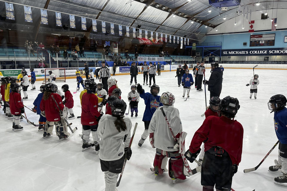 Players from around North America take part in the NHL All-Star Youth Hockey Jamboree Celebration at St. Michael's College School Arena in York, Ontario, Saturday, Feb. 3, 2024, during All-Star Weekend in Toronto. While Canada has seen a steep decline in children playing hockey in the sport's birthplace, the United States has experienced steady growth in that department over the past decade.(AP Photo/Stephen Whyno)