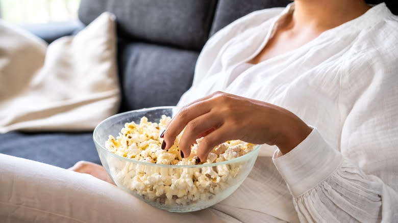 woman eating popcorn