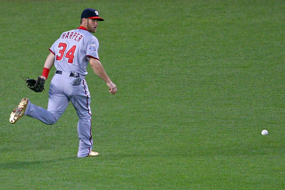 KANSAS CITY, MO - JULY 10: National League All-Star Bryce Harper #34 of the Washington Nationals is unable to make a catch on a ball hit by American League All-Star Mike Napoli #25 of the Texas Rangers in the fifth inning during the 83rd MLB All-Star Game at Kauffman Stadium on July 10, 2012 in Kansas City, Missouri. (Photo by Dilip Vishwanat/Getty Images)