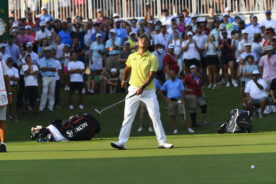 Hideki Matsuyama, of Japan, reacts when he misses a putt for birdie on the 18th green during the second playoff in the final round in the World Golf Championship-FedEx St. Jude Invitational tournament, Sunday, Aug. 8, 2021, in Memphis, Tenn. (AP Photo/John Amis)