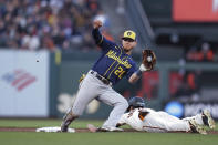 San Francisco Giants' Mike Yastrzemski (5) steals second base as Milwaukee Brewers third baseman Mike Brosseau (20) catches the throw the third inning of a baseball game in San Francisco, Thursday, July 14, 2022. (AP Photo/Godofredo A. Vásquez)