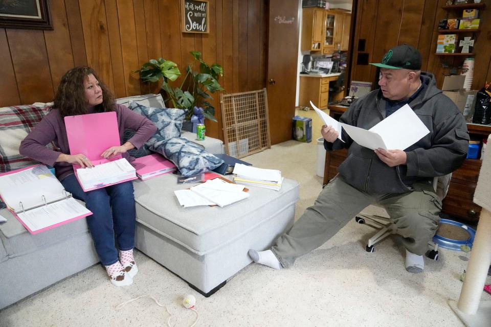 Kerrie Hirte looks through paperwork with her brother, Travis Wallenfang regarding the care and eventual death of Hirte’s daughter, Cilivea Thyrion, who died by apparent suicide at the Milwaukee County Jail Dec. 16, 2022. Hirte, seen at her home in Green Bay on Tuesday, Jan. 10, 2023, has questions about the circumstances surrounding her death and how, with a history of mental health, the jail failed to protect her and prevent her death despite rigorous protocols and policies laid out by the jail and the Milwaukee County Sheriff's Office.