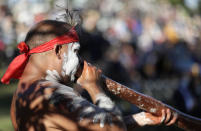 Russell Dawson of the Koomurri Aboriginal Dancers participates in a smoking ceremony during Australia Day ceremonies in Sydney, Tuesday, Jan. 26, 2021. (AP Photo/Rick Rycroft)