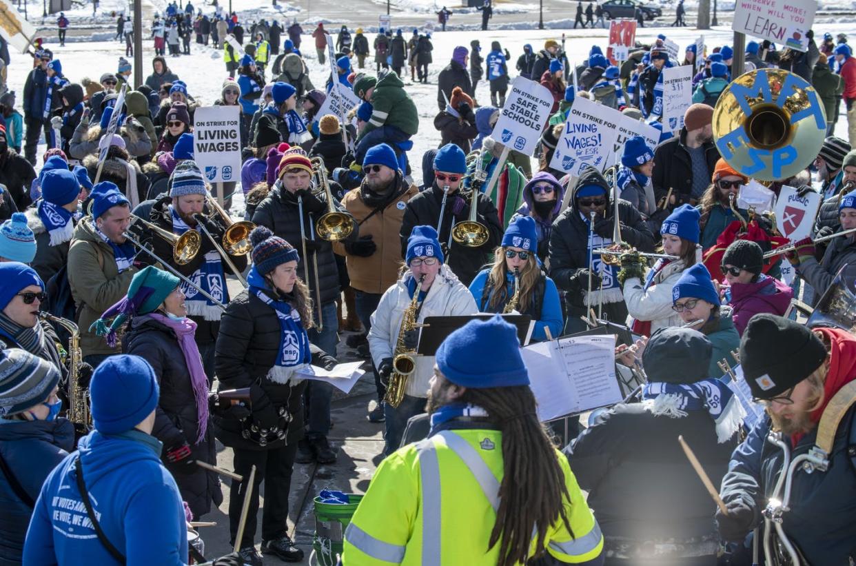 <span class="caption">Teachers and their supporters demonstrate in St. Paul, Minn., in March 2022.</span> <span class="attribution"><a class="link " href="https://www.gettyimages.com/detail/news-photo/st-paul-minnesota-march-6-2022-because-the-attacks-against-news-photo/1385208098" rel="nofollow noopener" target="_blank" data-ylk="slk:Michael Siluk/UCG/Universal Images Group via Getty Images;elm:context_link;itc:0;sec:content-canvas">Michael Siluk/UCG/Universal Images Group via Getty Images</a></span>