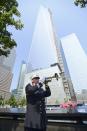 FDNY Captain Tom Engel plays taps at the 9/11 Memorial during ceremony marking the 12th Anniversary of the attacks on the World Trade Center in New York September 11, 2013. REUTERS/David Handschuh/Pool