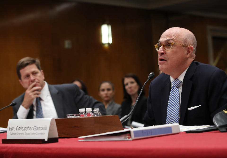 WASHINGTON, DC - MAY 08: Christopher Giancarlo,(R), Chairman of the Commodity Futures Trading Commission speaks while Jay Clayton, L , Chairman and the Securities and Exchange Commission listens during a Senate Appropriations Subcommittee hearing on Capitol Hill May 8, 2019 in Washington, DC. The Subcommittee is hearing testimony regarding FY2020 budget requests. (Photo by Mark Wilson/Getty Images)