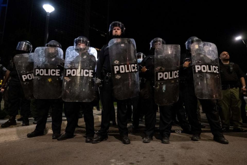 Police officers in Detroit monitor a demonstration on May 29, 2020, after the police killing of George Floyd in Minneapolis sparked protests nationwide. Detroit is being sued by one man who spent eight years in prison after a search based on a falsified warrant. (Photo by Seth Herald/Getty Images)