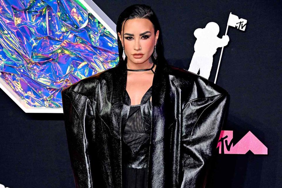 <p>Doug Peters/PA Images via Getty</p> Demi Lovato on the 2023 MTV VMAs pink carpet.