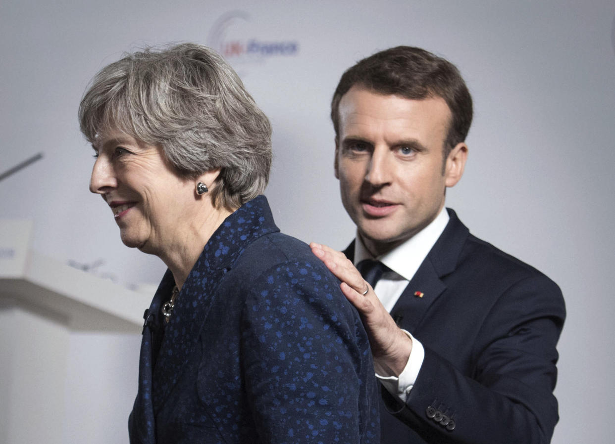 Theresa May and Emmanuel Macron during a media conference at the Royal Military Academy Sandhurst, in Camberley after UK-France summit talks yesterday (Stefan Rousseau/Pool via AP)