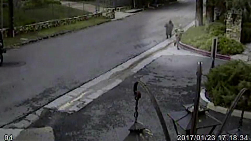 A neighbor's security camera captured two hooded figures (upper right) jogging near Fabio's house right around the time of the murder.  