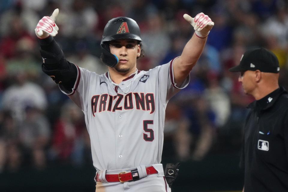 Diamondbacks outfielder Alek Thomas celebrates after hitting a double in the seventh inning against the Rangers in Game 2.