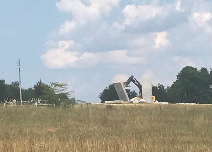 FILE - The Georgia Guidestones in Elbert County are shown knocked over during an investigation into the bombing of the monument on July 6, 2022.