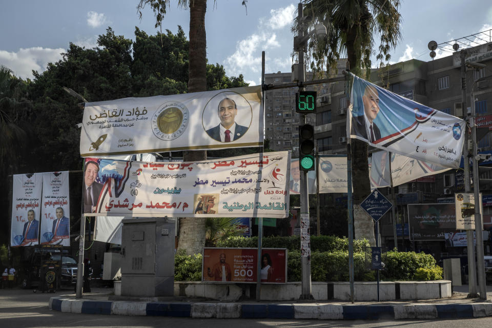 Election banners for candidates in the upper house of parliament are displayed on a street in Cairo, Egypt, Aug. 10, 2020. The elections will be held on Aug. 11 and 12. (AP Photo/Nariman El-Mofty)